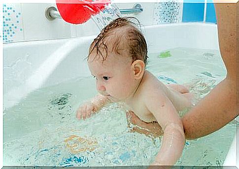 Crying babies calm down with a warm bath.