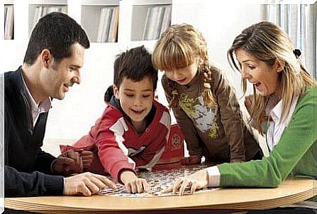 Family play together at the table