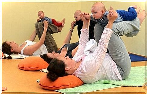 lonely mother doing baby gymnastics